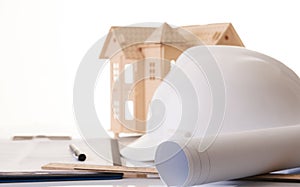 Helmet or hard hat, rolled ÃÂonstruction blueprints photo